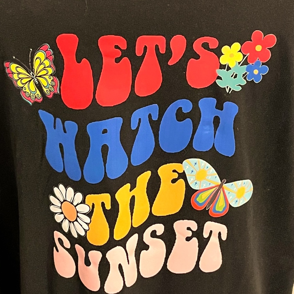 Womens oversized T shirt with “Let’s watch the sunset” on the back